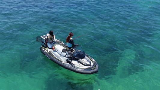 Aerial view of two people fishing from a Sea-Doo PWC expanded with an AIRJAIN jet ski collar, providing extra stability and deck space.