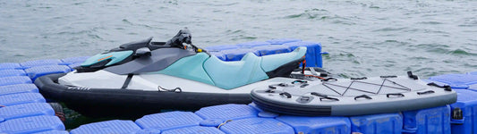 Sea-Doo PWC with an AIRJAIN jet ski collar and a rescue sled, both secured on a modular floating dock, ready for water sports