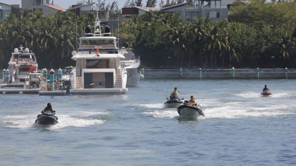 A fleet of Sea-Doo jet skis from Pangqing Fishing Club equipped with AirJain jet ski collars for an offshore expedition.