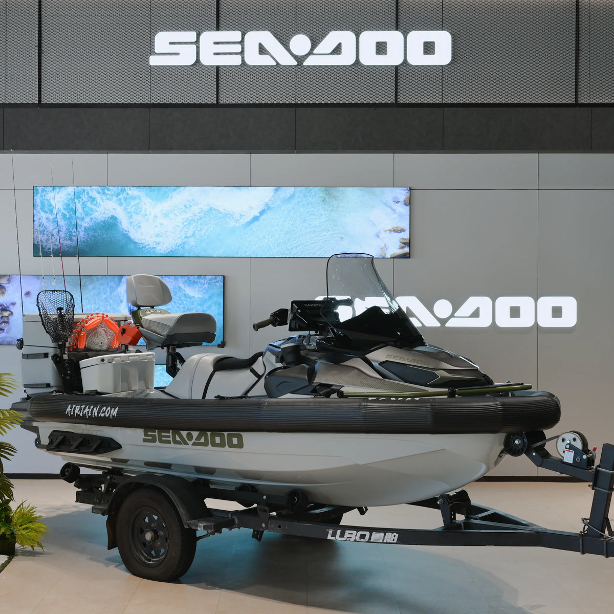Profile of a jet ski with a black inflatable collar mounted around the hull at the gunwale line