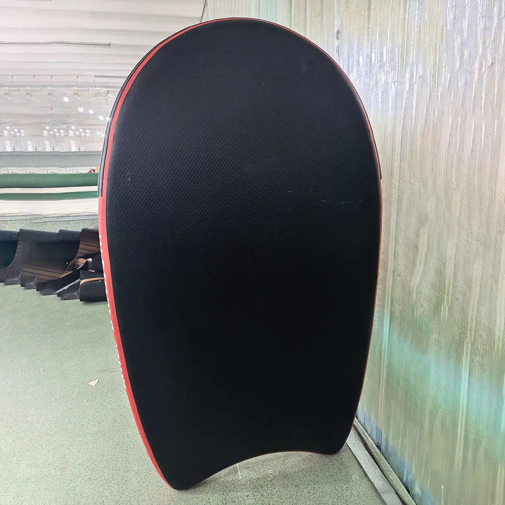Durable black bottom surface of the Airjain Pro inflatable rescue board for water sliding.