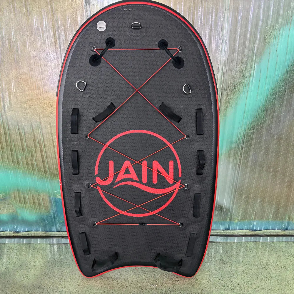 Airjain Pro inflatable water rescue board with red bungee cords and reinforced safety handles.