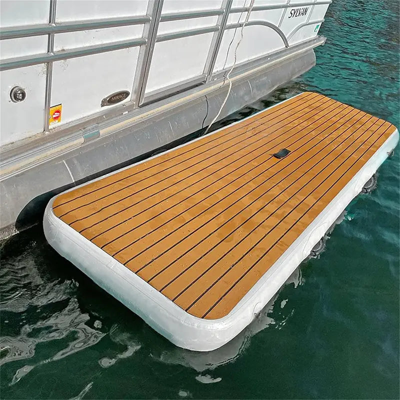 Inflatable yacht gangway tied alongside a pontoon boat, acting as an extended floating swim platform.