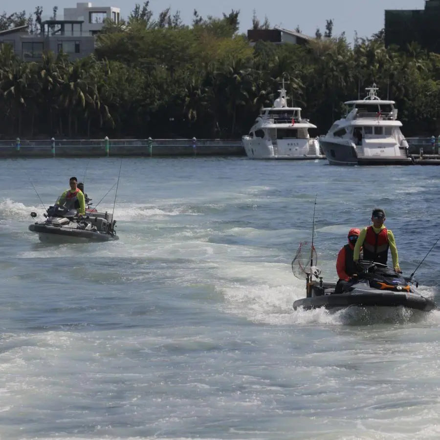 Jet ski with inflatable PWC collar cruising on open water with fishing gear mounted